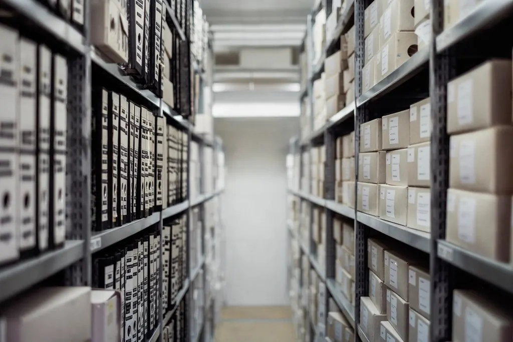 An archive aisle lined with record boxes — records, and how long they are kept