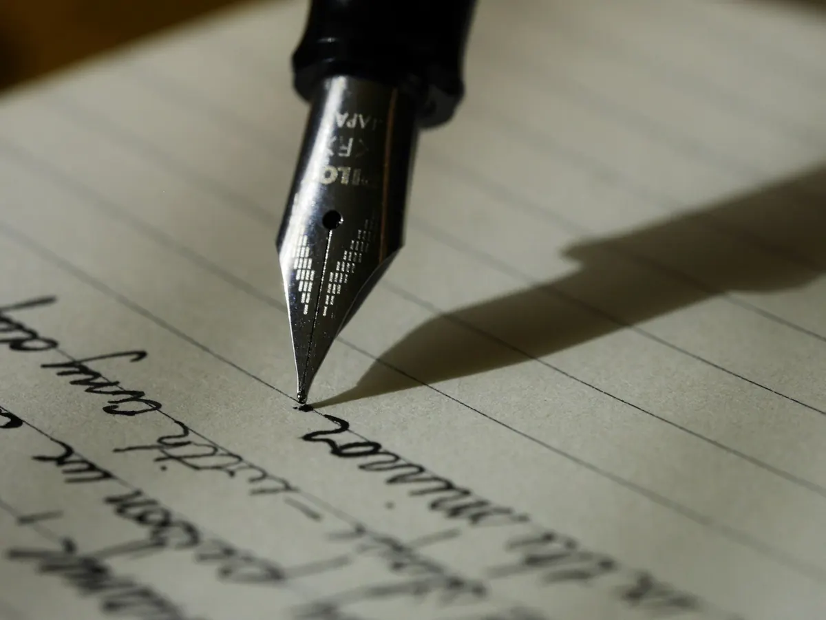 The draft A fountain pen nib writing on paper