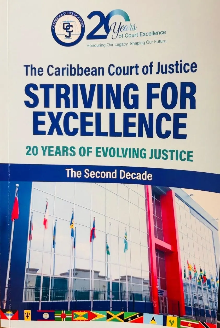 The cover of Striving for Excellence, marking twenty years of the Caribbean Court of Justice: the court building behind member states' flags